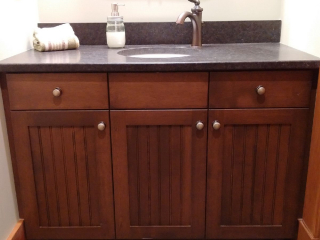 Stained vanity with granite countertop