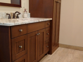 Stained vanity with granite countertop