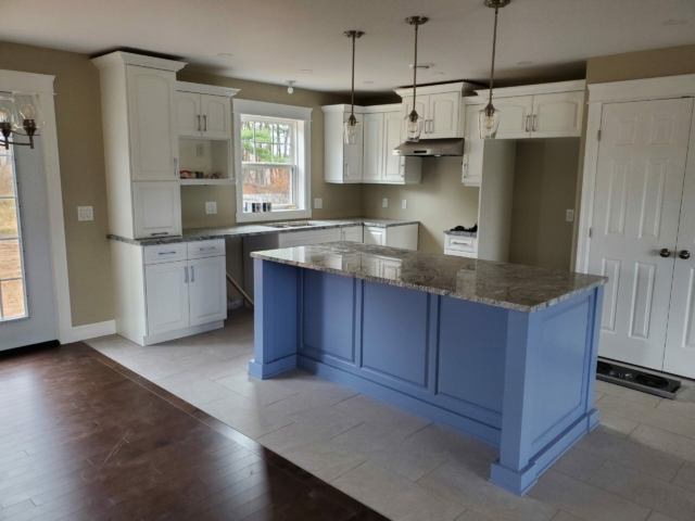 White Heron Kitchen, Steel Blue Island, Silver Cloud Granite Painted kitchen with Silver Cloud Granite Countertops