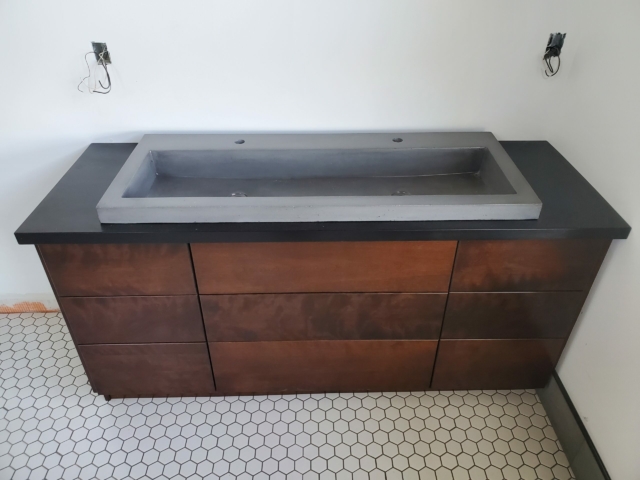 Stained vanity with trough sink
